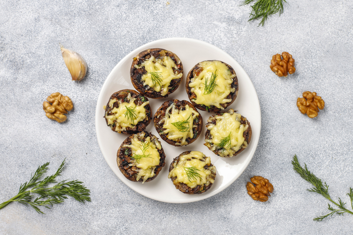 Homemade baked stuffed champignon mushrooms with fresh dill and